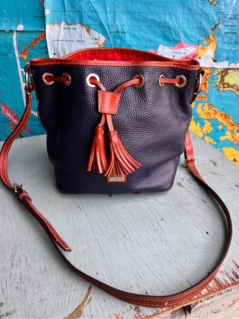 Dooney & Bourke Navy Pebbled Leather Crossbody Bucket Bag with Brown Trim